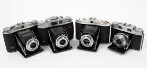 AGFA: Four c. 1950s vertical folding cameras - one Isolette II with Apotar 85mm f4.5 lens [#O060834], one Super Solinette with Solinar 50mm f3.5 lens [#R31848], one Isolette with Agnar 85mm f4.5 lens [#C43614], and one Isolette L with Color Apotar 85mm f4