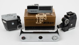 NIPPON KOGAKU: Four c. 1960s Nikon F attachments - one Photomic T finder [#901937] with reading attachment, one Photomic FTN finder [#543544], one Nikon Model 3 Exposure meter [#207462] in maker's box, and one Nikon F camera back. (4 items)