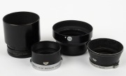 LEITZ: Four Leica lens hoods - one c. 1971 12508 R1.4/50 in black with rear cap, one c. 1956&nbsp;ITDOO in black and chrome, one c. 1956 ITOOY in black and chrome, and one c. 1951 TNGOO C2219 in black with rear cap.&nbsp;(4 items)