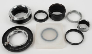 LEITZ: Eight different adapter rings of various diameters - one SOOGZ, one 14167 Leicaflex SL adapter, one UOORF, one FOOXB, one UOOND, one UOOYW, one 11251 Canada 5.5 in plastic case, and one Serie VI 14160. (8 items)