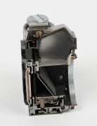 CANON: Circa 1976 Canon AE-1 camera body [#101862] vertical half cutaway model. - 2