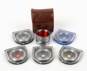 VOIGTLÄNDER: Ten 32mm chrome AR lens filters - set of five in leather maker's pouch containing 308/32 LW 2.5 orange 5x filter, 303/32 Focar 1, 304/32 Focar 2, and two 317/32 UV filters, together with five others in individual plastic maker's cases - 301/32 G1 yellow, 308/32 orange, 303/32 Focar 1, 304/32 Focar 2, and one 317/32 UV. (10 items)