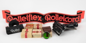 FRANKE & HEIDECKE: Eleven Rollei items - one FOBUM pistol grip quick release, one RI Tessar-Triotar-Xenar 3.5 green lens filter, one RII Planar-Xenotar 3.5 green lens filter, one RII Planar-Xenotar 3.5 light-blue lens filter, one RIII Planar-Xenotar 2.8 medium-yellow lens filter, one medium-yellow lens filter with smaller diameter (all lens filters in maker's boxes with leather or plastic cases), four plastic camera stands with Rollei branding, and one 56.5 x 10cm folding sign. (11 items)