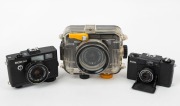 RIKEN: Three c. 1980 black-body compact cameras - one Ricoh A-2 [#51119678], one Ricoh A-2 [#51110734] in Ricoh Marine AD underwater enclosure, and one Ricoh FF-1 [#31247675]. (3 cameras)