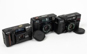 RIKEN: Three c. early 1980s black plastic compact cameras - one Ricoh AF-2 with lens cap, one Ricoh AF-5 with lens cap, and one Ricoh AF-60D. (3 cameras)