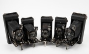 KODAK: Five c. late 1920s vertical-folding cameras - three No. 1 Pocket Kodaks&nbsp;with varying shutter, lens, and body details, together with two No. 1A Pocket Kodaks&nbsp;with differing lens and shutter details. (5 cameras)