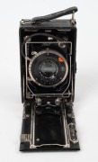 NAGEL: Recomar 18 folding plate camera, c. 1928, with Xenar 105mm f4.5 lens [#318541], Compur shutter, and shutter release cable.