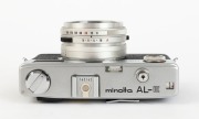 MINOLTA: Six c. 1960s rangefinder cameras - one Minolta AL [#138114], one Minolta 24 Rapid [#106155], one Minolta A5 [#411360], one Minolta AL-F [#803962], one Minolta AL-E [#145142] in maker's box with instruction booklet, and one Minolta Hi-Matic C [#51 - 4