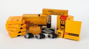 KODAK: Sixteen photography accessories, almost all in maker's boxes - three 35/80 optical finders, five Long Focal Length Special Condensors, one Self-Timer, one Pola-Screen and Viewer, one Tourist Adapter Kit, one Neck Strap, one Electric-Eye Remote Flash Unit, one Flashholder Camera Bracket, one Instamatic Flashcube Holder, and one Kodablitz flashgun. (16 items)