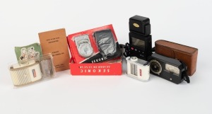 VARIOUS MANUFACTURERS: Five light meters - one E. Leitz New York Leicameter in leather case with instruction booklet, one Sekonic L-8b Leader De Luxe as new in maker's box with leather pouch, instruction booklet, and warranty card, one Sekonic Digipro X-1 Model L-518 with top attachment, one Gossen Sixtomat x3 in maker's box with chain, and one Gossen Sixon with instruction booklet. (5 items)
