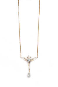 PENDANT NECKLACE: Edwardian 9ct yellow gold aquamarine and seed pearl pendant necklace.