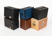 KODAK: Six different c. 1910s No. 2 Brownie box cameras - one black Model E in maker's box with instruction booklet,&nbsp;one Model F with fine-grained blue covering, one Model F with fine-grained green covering, one Model F with fine-grained black covering, o - 2