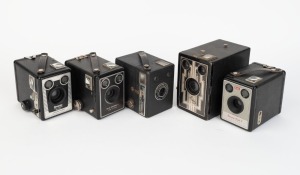 KODAK: Five c. 1940s box cameras - one Six-16 Brownie with metal Art Deco front plate, one Six-20 Brownie Junior, one Six-20 Brownie Model C, one Six-20 Brownie Model E, and one Brownie Flash II. (5 cameras)