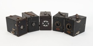 VARIOUS MANUFACTURERS: Five early 20th century box cameras - one Coronet Supreme Deluxe, two Ensign All-Distance models, one Agfa model, and one anonymous model. (5 cameras)