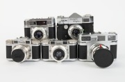 BRAUN: Five black and chrome c. 1950s 35mm cameras - one Paxette Reflex IB, one Paxette Super III with front lens cap, one Paxette Super II BL, one Paxette, and one Super Paxette with front lens cap. (5 cameras) - 2