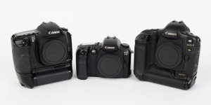 CANON: Three black digital SLR camera bodies with body caps - one c. 2002 Canon EOS-1Ds [#112850], one c. 2003 Canon EOS-10D [#396044], and one c. 2006 EOS D30 [#113400501], also known as the EOS 30D. (3 cameras)