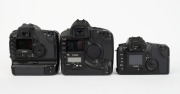 CANON: Three black digital SLR camera bodies with body caps - one c. 2002 Canon EOS-1Ds [#112850], one c. 2003 Canon EOS-10D [#396044], and one c. 2006 EOS D30 [#113400501], also known as the EOS 30D. (3 cameras) - 3