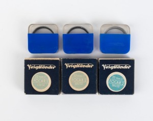 VOIGTLÄNDER: Six 32mm lens filters in plastic maker's cases, three also with maker's boxes - two 303/32 Focar 1, and four 304/32 Focar 2. (6 items)