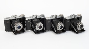 ZEISS IKON: Four c. 1950 Nettar horizontal-folding cameras - one 517/16 [#G 42147] with Novar 75mm f6.3 lens and Vario shutter, one 518/16 [#C 92272] with Novar 75mm f4.5 lens and Prontor-SVS shutter, one 517/16 [#W 29277] with Novar 75mm f4.5 lens and Pr