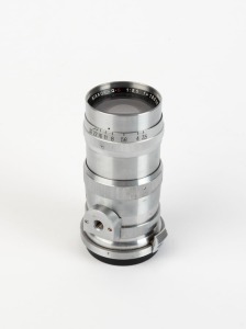 NIPPON KOGAKU: 1953 Nikkor-Q·C 135mm f3.5 lens [#256933] with bayonet mount, in chrome, together with metal rear lens cap.