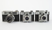 SANEI: Three late-1950s rangefinder cameras - one Samoca 35 Super [#590027] with Ezumar 50mm f3.5 lens, one Samoca 35 Super X [#595692] with Ezumar 50mm f3.5 lens and built-in selenium meter, and one Samoca LE-II [#952154] with Samocar 50mm f2.8 lens [#26 - 2