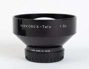 NIPPON KOGAKU: Four Nikkorex lenses - one black and chrome&nbsp;Nikkorex-Wide&nbsp;f5.6 with front and rear caps, one all black Nikkorex-Tele f5.6&nbsp;with front and rear caps, and two&nbsp;black and chrome Nikkorex-Tele&nbsp;f5.6&nbsp;lenses, one with Nikkorex lens hood and one&nbsp;with - 2