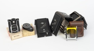 FRANKE & HEIDECKE: Eight accessories - one panorama head tripod attachment with spirit level in maker's box with instruction sheet, one Rolleifix FOFIX quick-locking tripod attachment for mounting in maker's box, one 3.5 gradient holder in maker's leather pouch, and a group of five TLR camera backs comprising two Rolleikin I camera backs with non-adjustable pressure plate, two backs with magazine holder for cut film plates, and one old-model plate film holder for Rolleiflex Automat. (8 items)