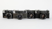 OLYMPUS: Four early-1960s rangefinders cameras - one Olympus Auto Eye [#130094] with D. Zuiko 45mm f2.8 lens [#132604], one Olympus Auto Eye II [#114235] with D. Zuiko 43mm f2.5 lens, one Olympus-S Electro Set [#103171], and one Olympus-SC [#144311] with - 2