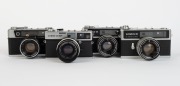 OLYMPUS: Four late-1960s rangefinder cameras - one Olympus-SC [#114769] with G. Zuiko 42mm f1.8 lens and lens cap, one Olympus-35 LE [#106112] with G. Zuiko 42mm f1.7 lens, one Olympus-35 LC [#142324] with G. Zuiko 42mm f1.7 lens and lens cap, and one Oly - 2