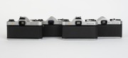 ASAHI KOGAKU: Four SLR cameras - one c. 1965 Pentax SL [#3011212] with Super-Takumar 55mm f1.8 lens [#4063340] and metal front lens cap, one c.1971 Pentax SP II [#5046356] with SMC Takumar 50mm f1.4 lens [#4652368], one c. 1973 Pentax SP-F [#6112861] with - 3