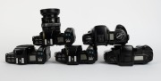 MINOLTA: Five&nbsp;black SLR camera bodies, one with lens and the others&nbsp;with plastic body caps&nbsp;- one Minolta Maxxum 7000 AF, one Minolta 7000 AF&nbsp;with AF Zoom 35-70mm f4 lens and lens hood, one additional Minolta 7000 AF, one Minolta Dynax&nbsp;7xi, and one Minolta - 4