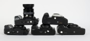 MINOLTA: Five&nbsp;black SLR camera bodies, one with lens and the others&nbsp;with plastic body caps&nbsp;- one Minolta Maxxum 7000 AF, one Minolta 7000 AF&nbsp;with AF Zoom 35-70mm f4 lens and lens hood, one additional Minolta 7000 AF, one Minolta Dynax&nbsp;7xi, and one Minolta - 5