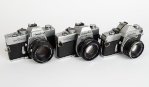 MINOLTA: Three SLR cameras - one c. 1962 Minolta SR-7 [#2393245] with Auto Rokkor-PF 53mm f2 lens [#1004720], one c. 1973 Minolta SRT-303 [#3060747] with MD Rokkor 50mm f1.7 lens [#2033565], and one c. 1975 Minolta SRT-100b [#8332984] with MC Rokkor-PF 50