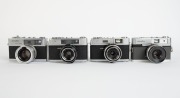 MINOLTA: Four black and chrome rangefinder cameras - one c. 1959 Minolta A3 [#107799] with Rokkor-TE 45mm f2.8 lens [#1109470], one c. 1964 Minolta Uniomat III [#406766] with Rokkor 45mm f2.8 lens, one c. 1966 Minolta A5 [#432355]&nbsp;with Rokkor 45mm f2.8 le - 2