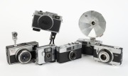 RIKEN: Six c. 1960s chrome-body cameras - one Ricoh Auto Shot, one Ricoh Caddy, one Ricoh Caddy with lens cap and BC-605 flash unit, one Ricoh Auto Half [#321569], one Ricoh 126-C EE [#205861] with Ricoh self-timer attachment, and one Ricohmatic 126 with 