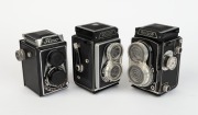 LIPCA: Three early-1950s TLR cameras together with front lens caps - one Flexo with Ennar&nbsp;C 75mm f3.5 lens [#167980] and Prontor-S shutter, one Rollop I [#0 56765] with Ennagon C 75mm f3.5 lens [#42272] and Prontor-SVS shutter, and one Rollop Automatic [#
