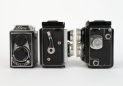 LIPCA: Three early-1950s TLR cameras together with front lens caps - one Flexo with Ennar&nbsp;C 75mm f3.5 lens [#167980] and Prontor-S shutter, one Rollop I [#0 56765] with Ennagon C 75mm f3.5 lens [#42272] and Prontor-SVS shutter, and one Rollop Automatic [# - 2
