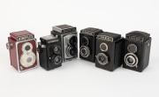 VARIOUS MANUFACTURERS: Six mid-20th century TLR&nbsp;cameras - one Atak Inka, one Atoms Aiglon Reflex I, one GOMZ Lubitel&nbsp;with Cyrillic lettering, one Tokiwa Firstflex I,&nbsp;one rare red Haking Kinoflex Super Reflex,&nbsp;and one Rosko Bedfordflex. (6&nbsp;cameras)