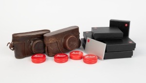 LEITZ: Six aluminium bank card holders each featuring Leica 'Red Dot' logo, all in black maker's boxes, with removable triple inserts for SD memory cards, together with four Leica 'Red Dot' tins 5cm in diameter, and two vintage leather camera cases. (12 i