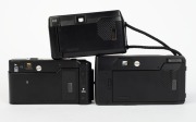 ASAHI KOGAKU: Three c. 1980s black plastic compact cameras - one Pentax PC 35 AF-M, one Pentax Zoom-70, and one Pentax AF PC-303 with wrist strap. (3 cameras) - 3