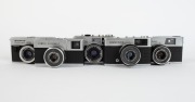 OLYMPUS: Five c. 1967 chrome-body cameras - one Quickmatic 600 [#239381] with E. Zuiko 38mm f2.8 lens, one Quickmatic EES [#125385] with D. Zuiko 36mm f2.8 lens, one Quickmatic EEM [#202513] with D. Zuiko 36mm f2.8 lens, one Trip 35 [#1332885] with D. Zui - 2
