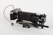 ASAHI KOGAKU: Pentax Spotmatic SLR camera [#3571943], c. 1964, with Super Takumar 55mm f2 lens [#4058221], Pentax Auto Bellows, Slide Copier, 55mm metal bellows scale, and double cable release. Complete with maker's boxes for camera and auto bellows set.