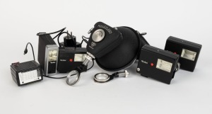 FRANKE & HEIDECKE: Eight flash accessories in black - two Rolleiflash with differing diameters plus one additional camera attachment element, one Strobomatic E 17C with power cable, one 121BC with sync cable, one 100 XL, one 128BC, and one E 19 BC. (8 ite