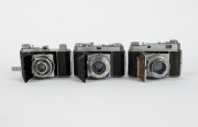 KODAK: Three vertical-folding cameras - one c. 1937 Retina I 141 with Ektar 50mm f3.5 lens [#1250712], one c. 1949 Retina II 014 with Retina-Xenon 50mm f2 lens [#2203286] in maker's box, and one Retina Ia 015 with Retina-Xenar 50mm f2.8 lens [#3254034].&nbsp;( - 2