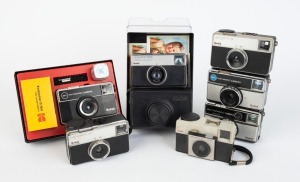 KODAK: Seven c. 1970s compact cameras - one Instamatic 25 in maker's box, one Instamatic 33, one Instamatic 56 X in maker's box with film roll/strap/flash cube, one Instamatic 133 with maker's box, one Instamatic 155 X, one Instamatic 233 X in maker's box with leatherette case and instruction booklet, and one Instamatic 355 X. (7 cameras)