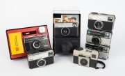 KODAK: Seven c. 1970s compact cameras - one Instamatic 25 in maker's box, one Instamatic 33, one Instamatic 56 X in maker's box with film roll/strap/flash cube, one Instamatic 133 with maker's box, one Instamatic 155 X, one Instamatic 233 X in maker's box