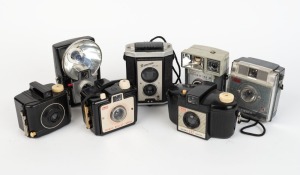 KODAK: Seven 127 rollfilm cameras - one c. 1939 Baby Brownie Special, one c. 1946 Brownie Reflex with maker's box, one c. 1953 Brownie 127, one c. 1957 Brownie Bullet, one c. 1957 Brownie Starflash, one c. 1962 Brownie Fiesta, and one c. 1962 Brownie Starmite II with maker's box. (7 cameras)