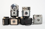KODAK: Seven 127 rollfilm cameras - one c. 1939 Baby Brownie Special, one c. 1946 Brownie Reflex with maker's box, one c. 1953 Brownie 127, one c. 1957 Brownie Bullet, one c. 1957 Brownie Starflash, one c. 1962 Brownie Fiesta, and one c. 1962 Brownie Star - 2