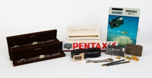 ASAHI KOGAKU: Twenty-three Pentax-branded items, including six Hong Kong-made quartz wristwatches in silver and gold, five of them in presentation boxes, together with three ball-point pens in black and gold, two ball-point pens in white and gold, five di
