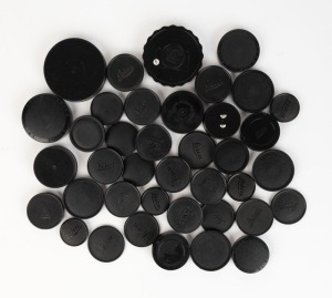 LEITZ: A mixed assortment of thirty-nine black plastic Leica front and rear lens caps and body caps, all of various diameters. (39 items)